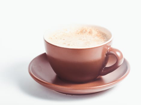 Coffee cup with crema on a white background