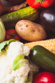 Vegetables background on the wooden table closeup