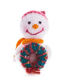 Knitted snowman with christmas wreath isolated on white