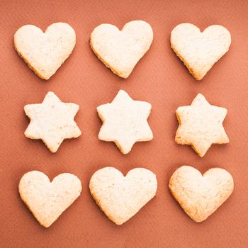 Holiday cookies as a background pattern on brown