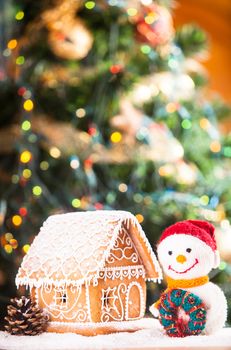 gingerbread house over on the snow and lovely handmade snowman