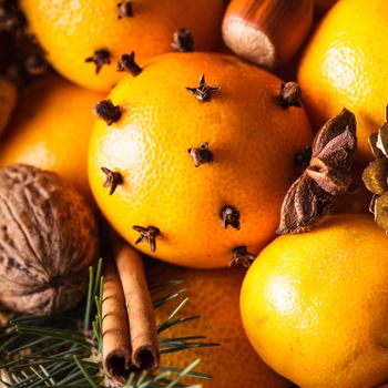 Christmas basket - fir, tangerins and spices on the snow