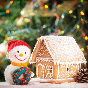 gingerbread house over on the snow and lovely handmade snowman