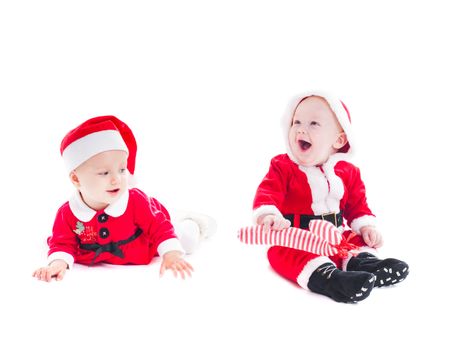 Adorable Santa babies - boy and girl isolated on white 