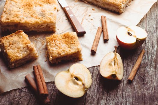 Apple cake with grated apples and cinnamon on the table
