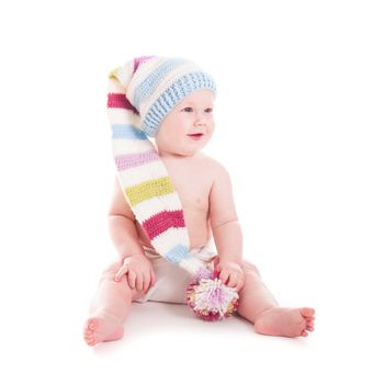 Adorable 6 month baby in funny crochet hat isolated on white