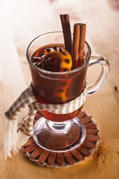 A mulled wine in the glass cup - warming drink