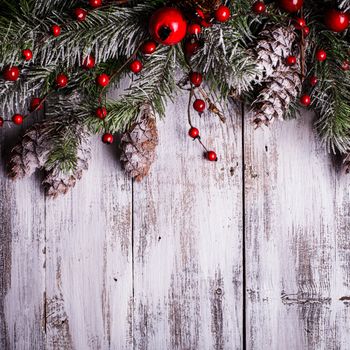 Christmas border design with snow covered pinecones