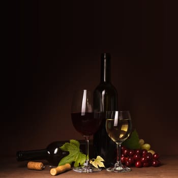 Wine still life: bottles, corks, grapes and glasses