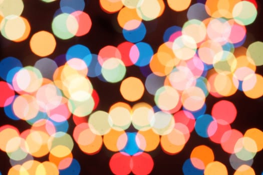Blurred colorful lights  on a black background
