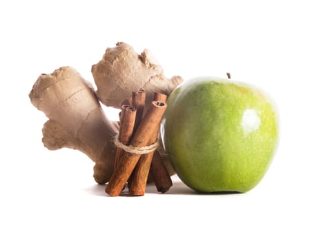 Apple, cinnamon and ginger isolated on white