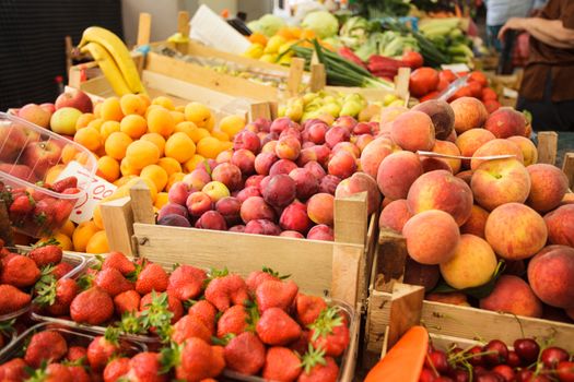 Various fresh fruits in boxes on the market