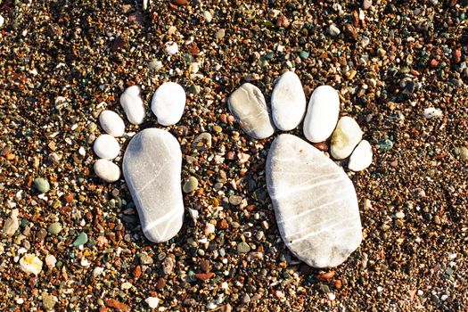 Stone foots on the beach. Spa or vocation concept. Adriatic seashore