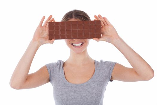 Portrait of a smiling woman holding a chocolate tablet, isolated on white