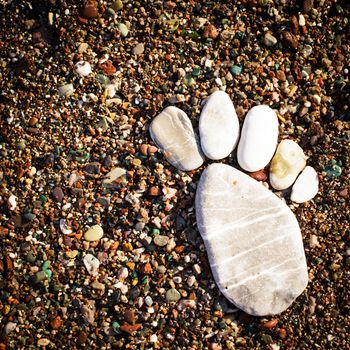 Stone foot on the seashore. Spa or vocation concept. Adriatic sea.