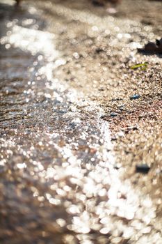 Adriatic sea pebble shore, as an abstract background for design. Vocation concept. Shallow deep of field