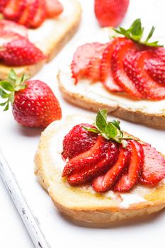 Summer breakfast - toasts with butter and strawberry