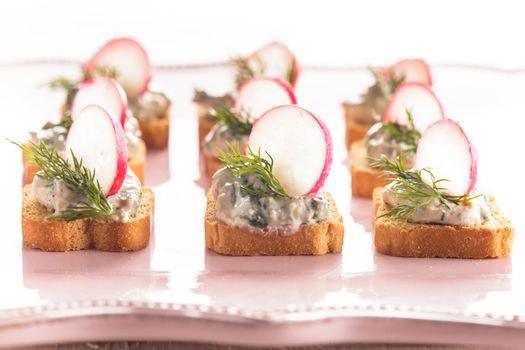 canapes with cream cheese pasta with dill and radish