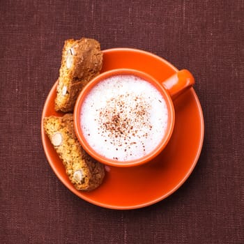 Cantuccini - typical almond cookies with cappuccino cup