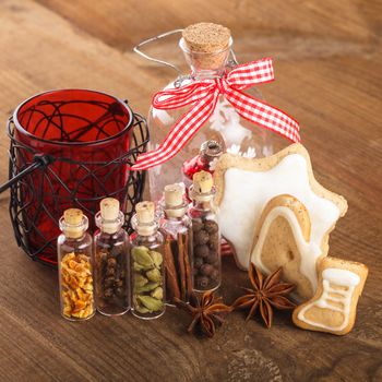 Christmas spices for mulled wine or ginger cookies in small decorative bottles