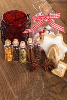 Christmas spices for mulled wine or ginger cookies in small decorative bottles