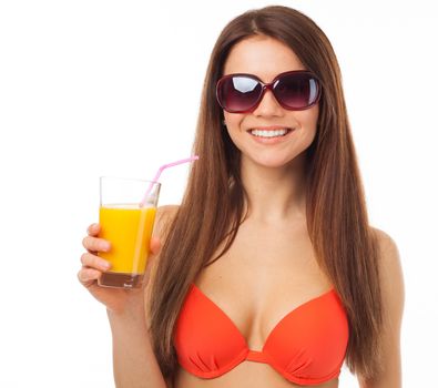 Girl with sunglasses drinks orange juice in summer, isolated on white