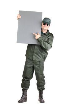 Man in workwear stands with board. Isolated on a white background