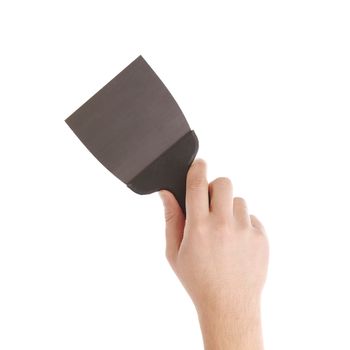 Hand holds construction spatula. Isolated on a white background.