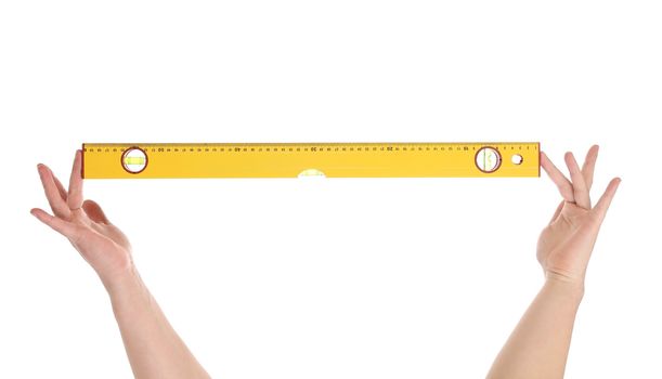Yellow building level in hands. Isolated on a white background.