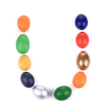 Letter U from the eggs for easter. Isolated on a white background.