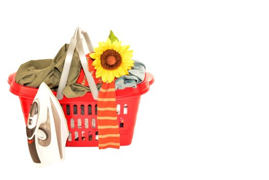 basket full of wrinkled clothes and iron isolated on white background, blank space for text
