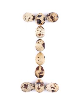 quail eggs in the form of letter I. Isolated on a white background