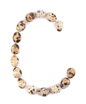 quail eggs in the form of letter C. Isolated on a white background