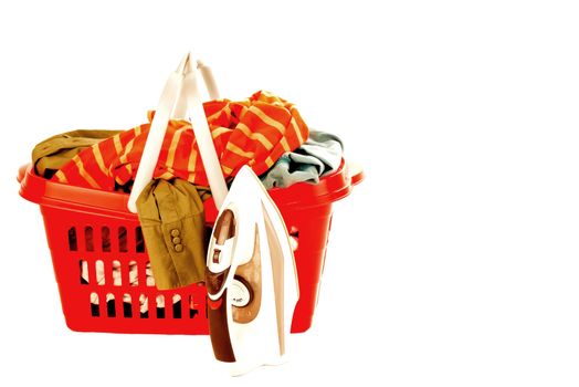 ironing clothes in a red basket and iron, isolated, with blank space for text