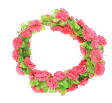 Wreath of artificial flowers. Isolated on a white background.