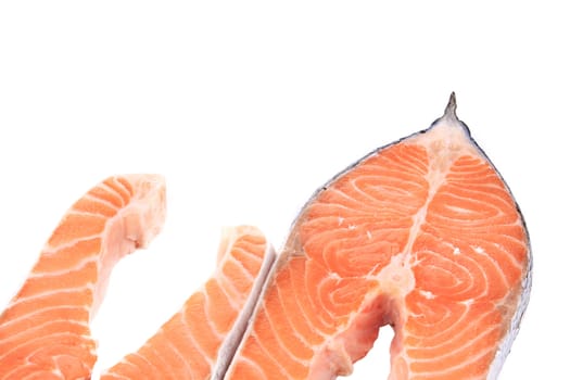 Two pieces of salmon. On a white background.