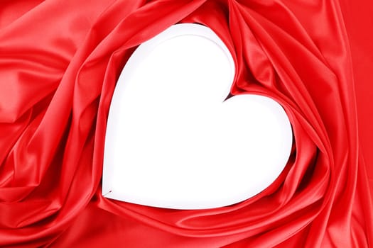 Paper heart in red satin. To be used as background.