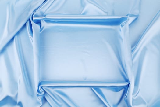 Square in blue fabric. To be used as background.