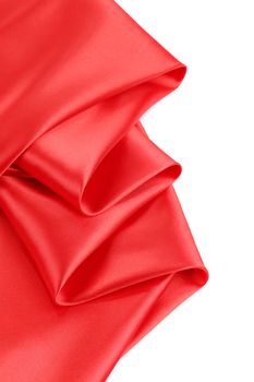 Folds of red satin. On a white background.