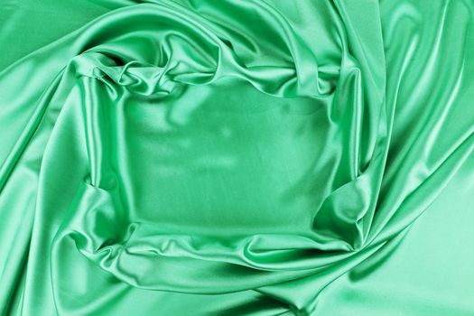 Square in emerald fabric. To be used as background.