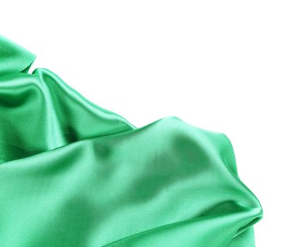 Folds of emerald satin. On a white background.