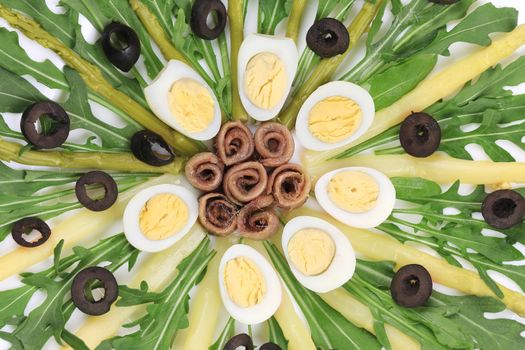 Salad with anchovies and asparagus. To be used as background.