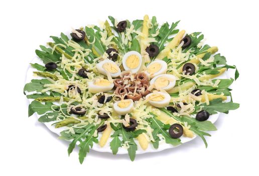 Salad with anchovies and asparagus. On a white background.