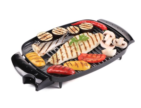 Grilled seabass on grill with vegetables. Isolated on a white background.