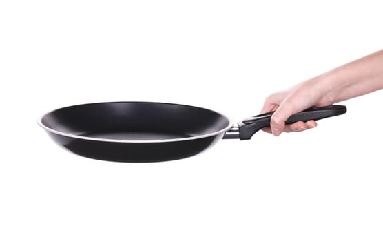 Hand holding a black frying pan. Isolated on white background