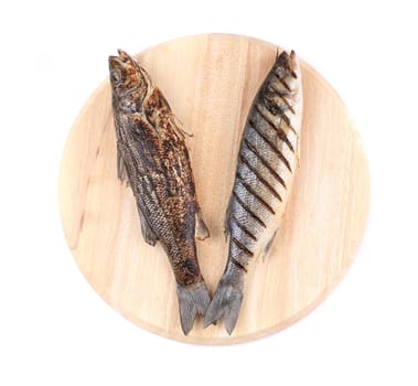 Two grilled seabass fish on platter. Isolated on a white background.