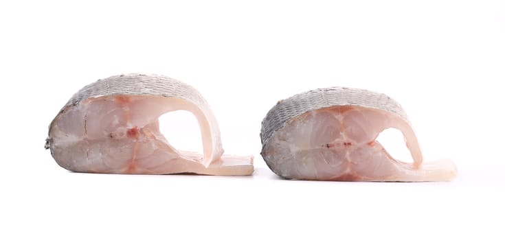 two fresh steaks of seabass. Isolated on a white background.