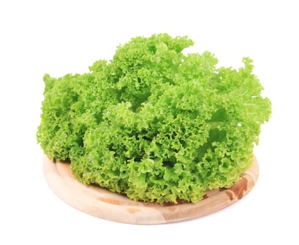 Fresh lettuce on wooden platter. Isolated on a white background.