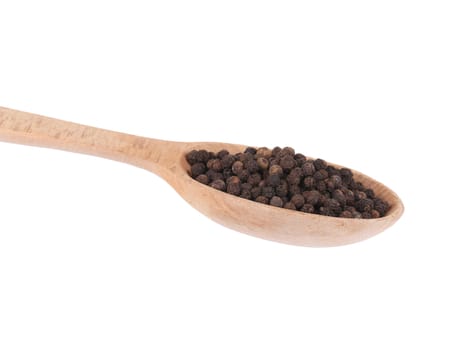close up of black peppercorns on a wooden scoop. isolated on a white background