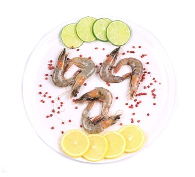 Raw shrimps on plate. Close up. Isolated on a white background.